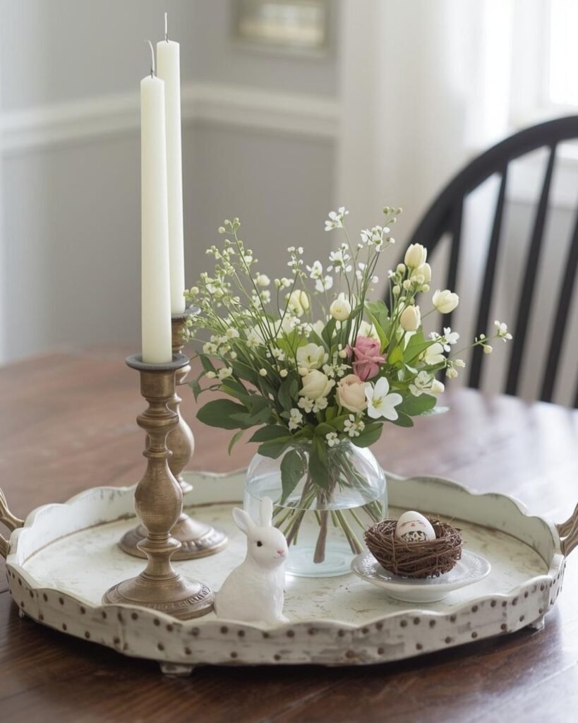 Simple vintage Easter tray with candlesticks, spring flowers, and a subtle bunny accent