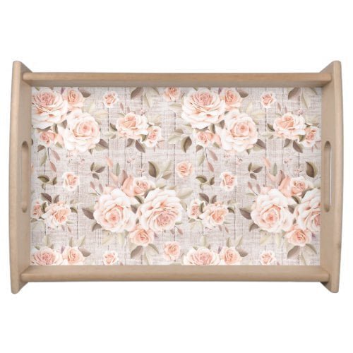 Wooden tray lined with light peach flowers.